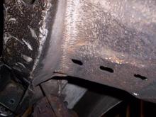driver foot well near front wheel arch solid