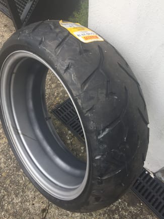 Cut the centre out of a steel wheel and put the tyre on for mocking up purposes. Mark from MK did offer to make me a billet ally wheel but I wanted to keep it ghetto