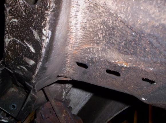 driver foot well near front wheel arch solid