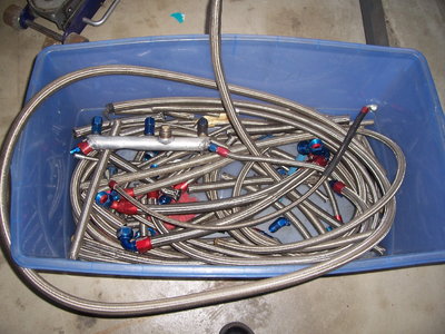 total of over 50lbs of braided hoses & fittings - 