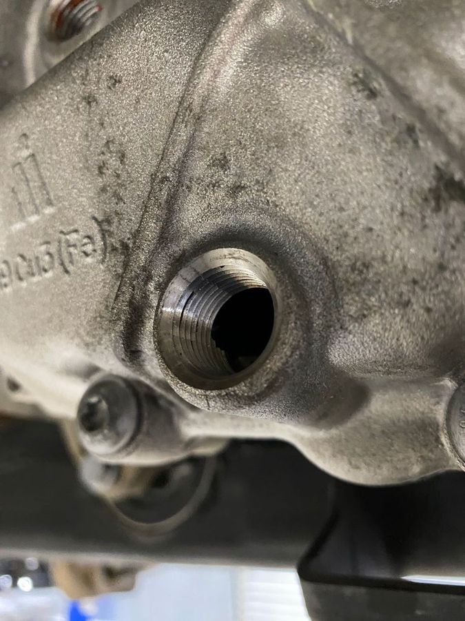 You can see cracks around the threading.  