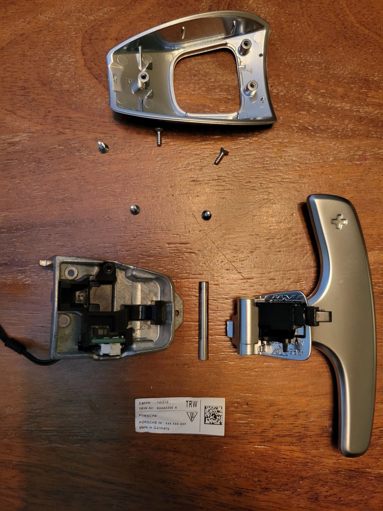 Removed Torx screws and pushed out hinge pin to disassemble shifter.