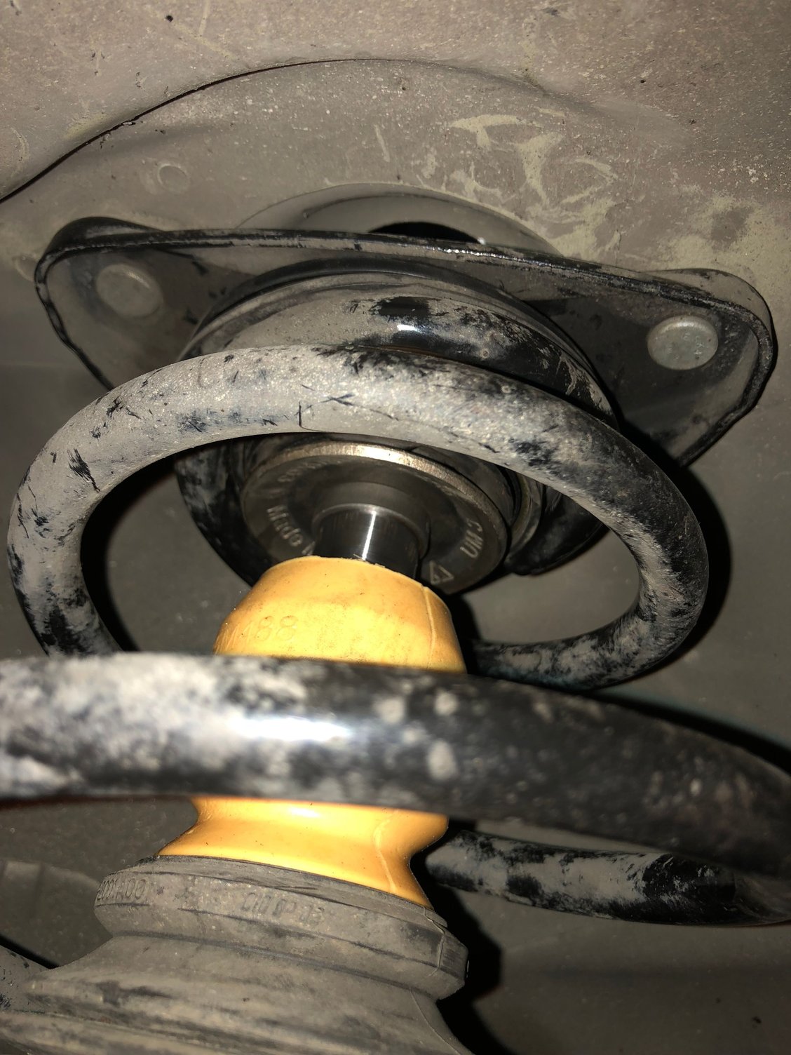 997 front springs hard to align on the top strut mount properly