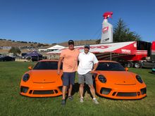 Eric and I with our Pastel Orange cars.