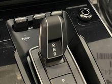 The $850 optional PDK aluminum gear selector is less than impressive....