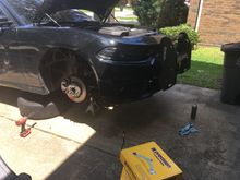 Helping the neighbor with his car drinking beer  and talking all kind of shiiiiiit 