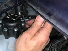 Accessing front mounting bolt