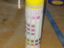 Test strip showing red on the pH test patch