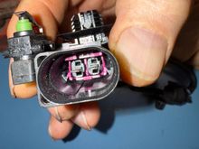 Outside handle switch. Normally open circuit. 
Lift handle equals closed circuit. Window drops some. 
Door opens, latch rotates cam clockwise=closed circuit. 
Door handle released=normally open circuit. 
Cam in latch maintains at full CW position with door open.
Cam and switch maintains a closed circuit. 

