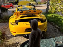 my trusted assistant helping me once more. I'll skip all of the bumper / tail lights / spoiler removal as they are pretty well covered (thank you Pelican for the nice write ups!)



