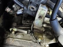 Bracket to chain tensioner hard line installed
