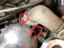 3. Remove two bolts securing pump reservoir