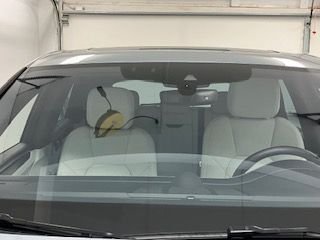 EZ Pass transponder mounted on windshield after being enclosed in silicone skin