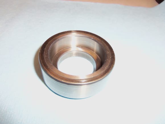 Underside of cap, showing machined inner surface for sealing the O-ring.