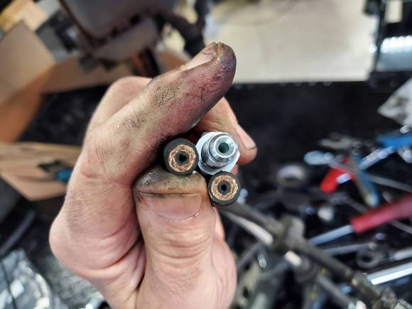 Look at the difference in the line size of the new stainless lines vs the swollen and crusty originals. Look closely as there is more black rubber inside of the thread reinforcement 