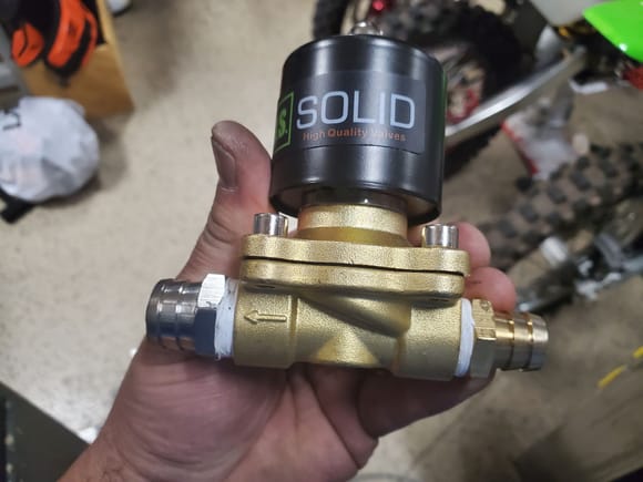 Here's the solenoid valve with the proper sized hose barbs installed and I shortened the barbs so it would fit in the factory location.