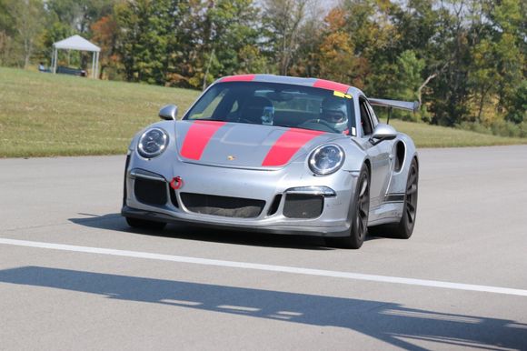 I put R stripes on my RS—aftermarket of course.  I like them.  Plus, they are very helpful at the track...easy to see in rear view mirror!  Good luck with choice.  Get what you like! 