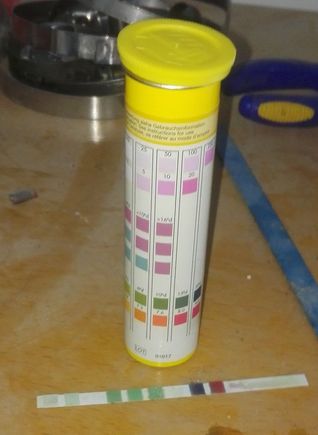 Test strip showing red on the pH test patch