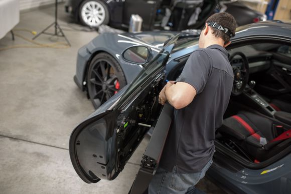 For a seamless door wrap(lacking a seam above the mirror stem and inside the door handle), some disassembly is required. I can't tell you how many of these doors we've taken apart! So no need to fear odd squeaks, missing parts or problems down the road. 