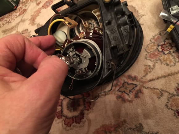 Disconnect the brown and yellow wires, and then remove the stock halogen bulb