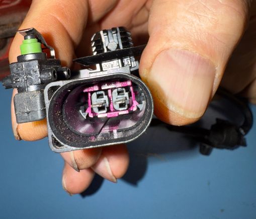 Outside handle switch. Normally open circuit. 
Lift handle equals closed circuit. Window drops some. 
Door opens, latch rotates cam clockwise=closed circuit. 
Door handle released=normally open circuit. 
Cam in latch maintains at full CW position with door open.
Cam and switch maintains a closed circuit. 

