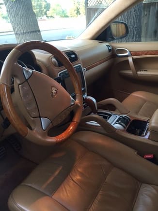 Not the biggest fan of the wooden steering wheel, but doesn't look so bad on a tan interior.