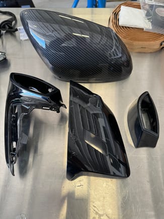 Here are the 4 plastic pieces for the mirror housing - the main difference is the center front piece (bottom of mirror) that comes in blank (stock GT3), light, or light and camera.  This particular one has light and camera.