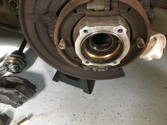 Rotor, caliper, and rear hub halves removed.  Bad bearing exposed