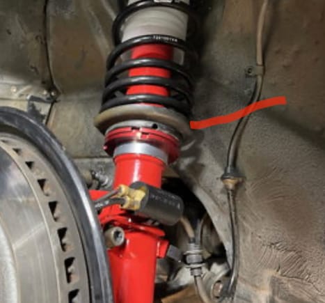 What is the piece the red line touches below the spring and above the perch. I’m sorry I’m not trying to be a smart ass the whole lower perch area looks odd I just put hr springs on mine 