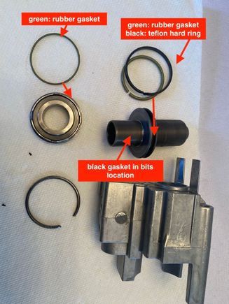 all of the parts and the location of the gasket that was in bits. Im not sure if it an oil seal or designed to be a buffer stopping the piston from hitting the plate metal on metal. Maybe it is both