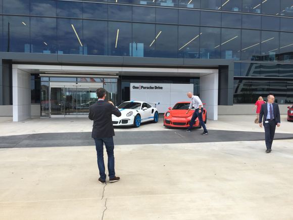 Dr. Walliser taking photos of Sean and Dave's cars.