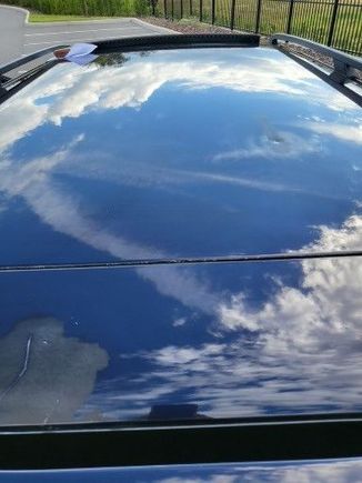 prior owner must have had a rack with a canoe or something and touched up 2 areas with sort of matching paint