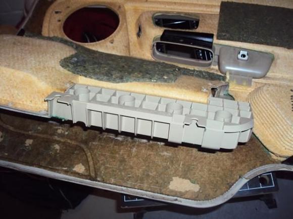 This photo shows the door pocket assembly, it comes off as one unit.