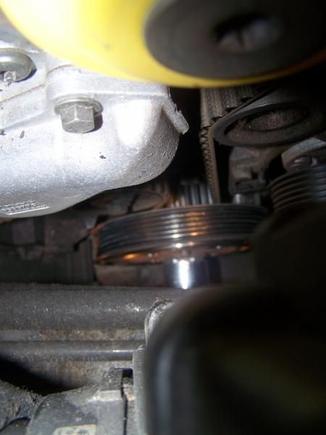View of timing belt and pulleys.