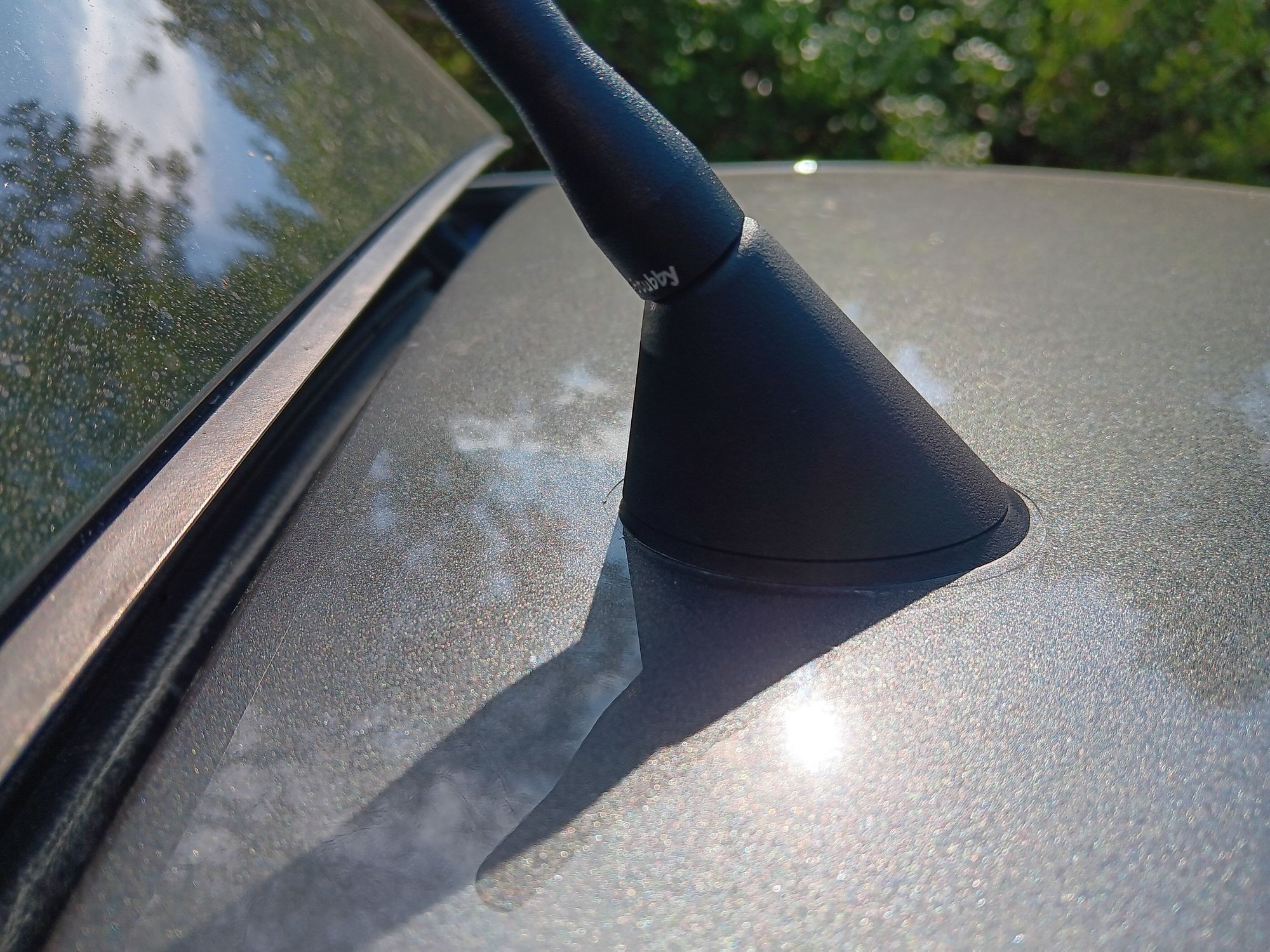 The correct OEM Aston antenna base and gasket after installation. 