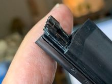 Little arm pushed back in to hold the rubber in place.
