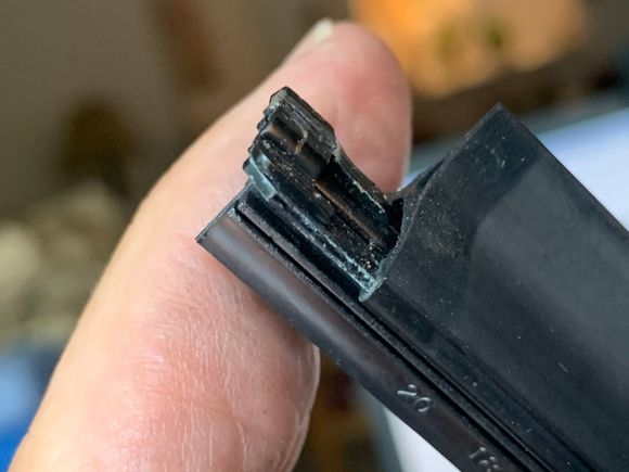 Little arm pushed back in to hold the rubber in place.