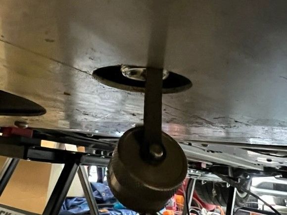 Valve screw cap/cover removed (attached to valve by leash)