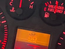  It kind of looks like a face, two big eyeballs, a hat and a flat grin!