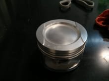 Each piston took another hour and a half of polishing by han first with a green scotch brite then a white scotch brite pad coated in a fine lubricating oil. The teflon coating remained untouchedand these are pics of the final product.