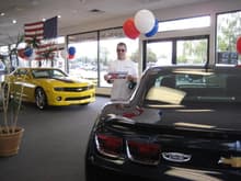 Here's Steve da Wrench with the CamaroZ28.com logo in a dealership in Twin Falls, Idaho (of all places) where they had Camaros waiting for a forever home.  Our Camaro is parked outside.  We happened to stay in this town for the night on our 2-week road trip in September when we were on our way to the NEOCC Camaro Show in Ohio.