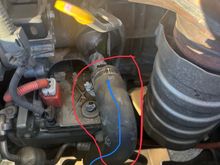 Front of the engine just below the dip stick running to just below the radiator 