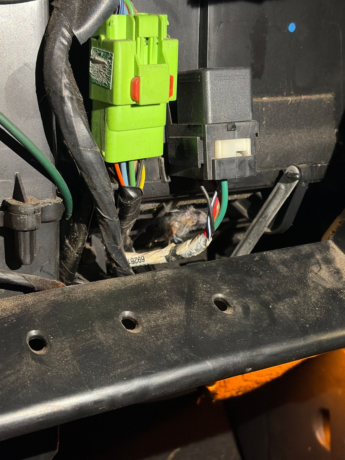 View from behind interior glove box of debris