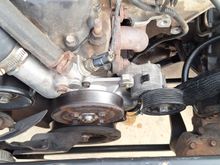 Chevy 5.3l Belt tensioner mounted to water pump with modification.