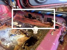Passenger Side: Rust goes halfway up the door jamb.