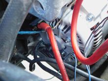 This is my new 136 amp alternator. You can see the new 4 AWG OFC red wire.  But the main GND from the alternator is the questionable one spliced into the main battery terminal GND wire.  Can I reroute the ALT GND straight to the engine block, then make a new NEG battery wire 4 AWG OFC, straight from battery to engine block?
