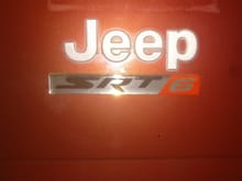 Sorry for the bad picture bad lighting in the garage, but here is the SRT6 badges, pretty cool I think, Ill have one here on the trunk and then one on each side where it under the  cherokee decal.