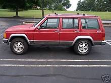 Cherokee driver's side has a dent-ebay pic