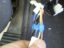 Here is the splice connector placed around the 2 wires. the "Blade" has not been squeezed yet.