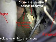 This picture was taken looking down towards the transmission from the driver side front wheel. The sensor has already been removed. You can see the two bolt holes for the sensor.
